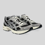 ASICS Men's Gel-1130 Sneaker in Black/Carbon