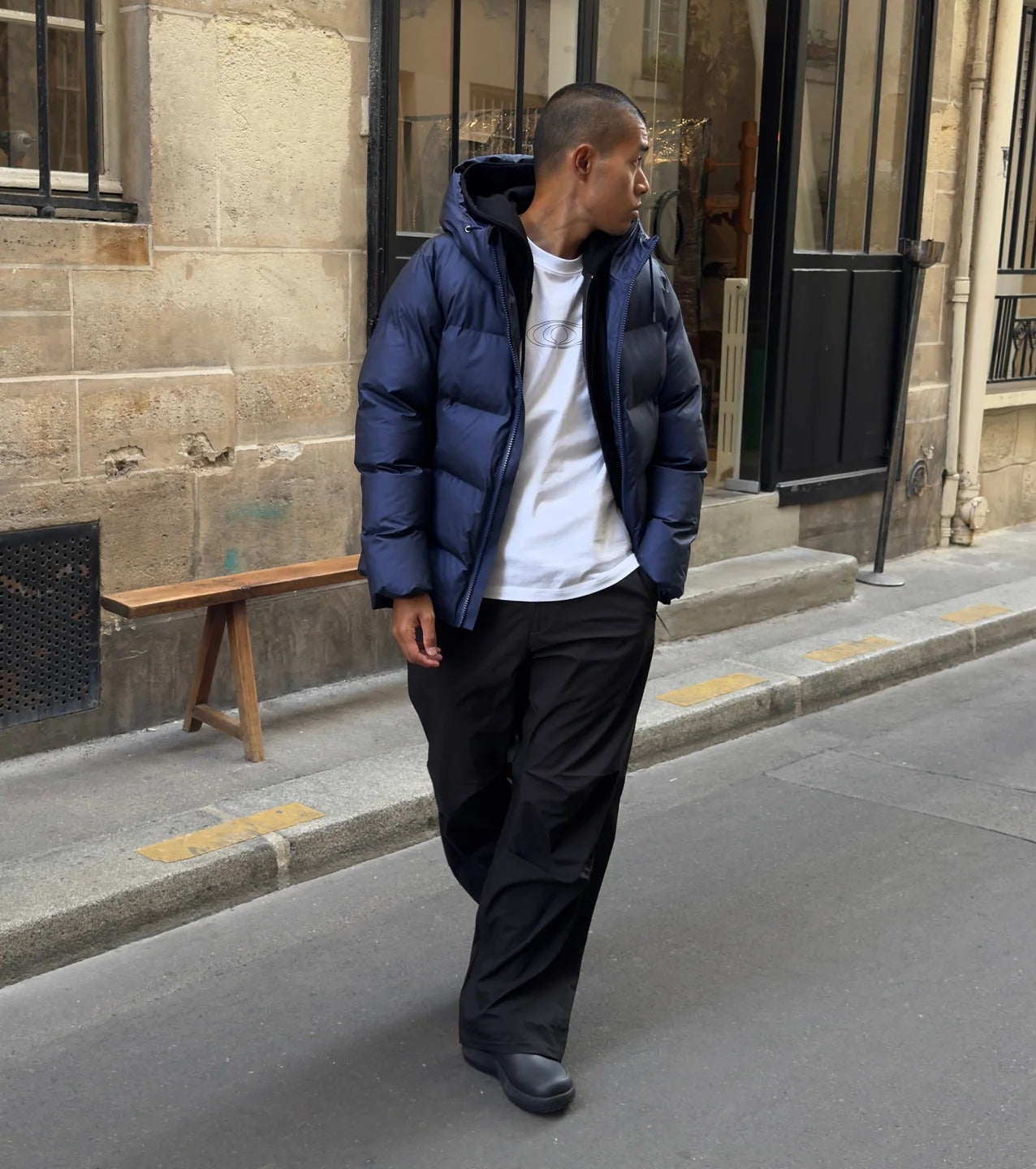 Rains Alta puffer jacket worn on a city street
