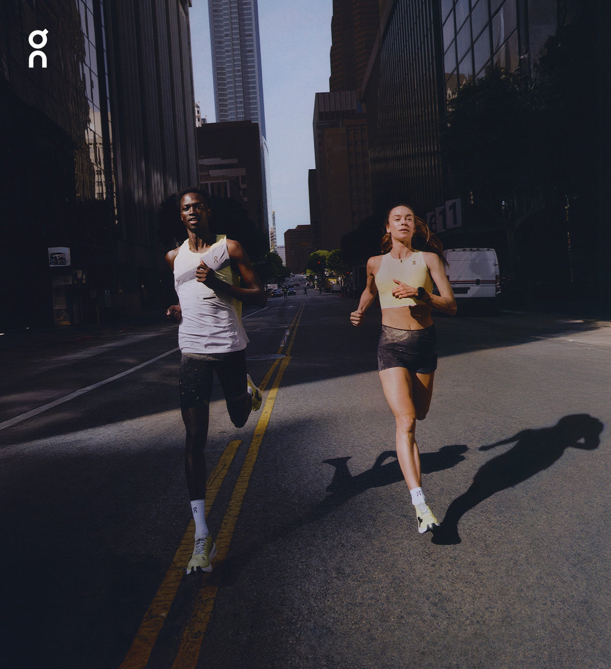 Two runners on a city street